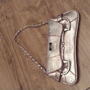 ROSE GOLD CLUTCH PURSE. NICE  CHAINED HANDLE .